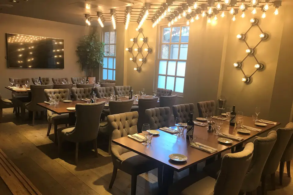 Private dining room at Saint Pauls House, elegant setting for corporate events and gatherings.