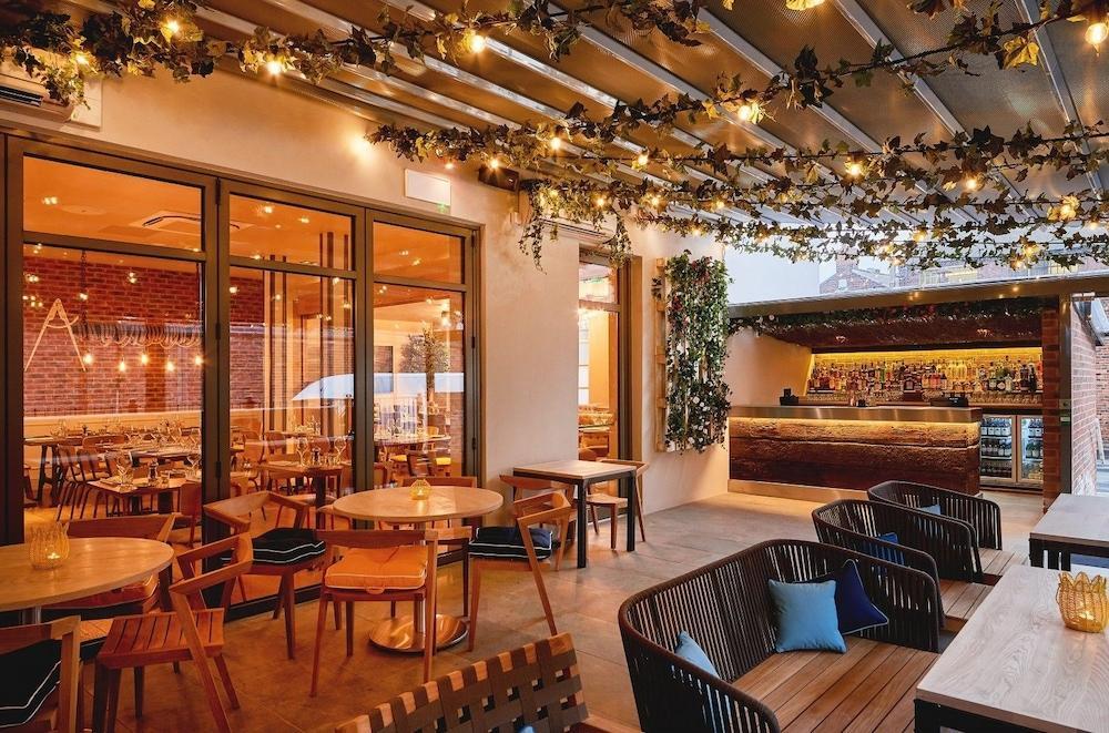 Private dining room at Saint Pauls House, stylish outdoor venue for events and receptions.