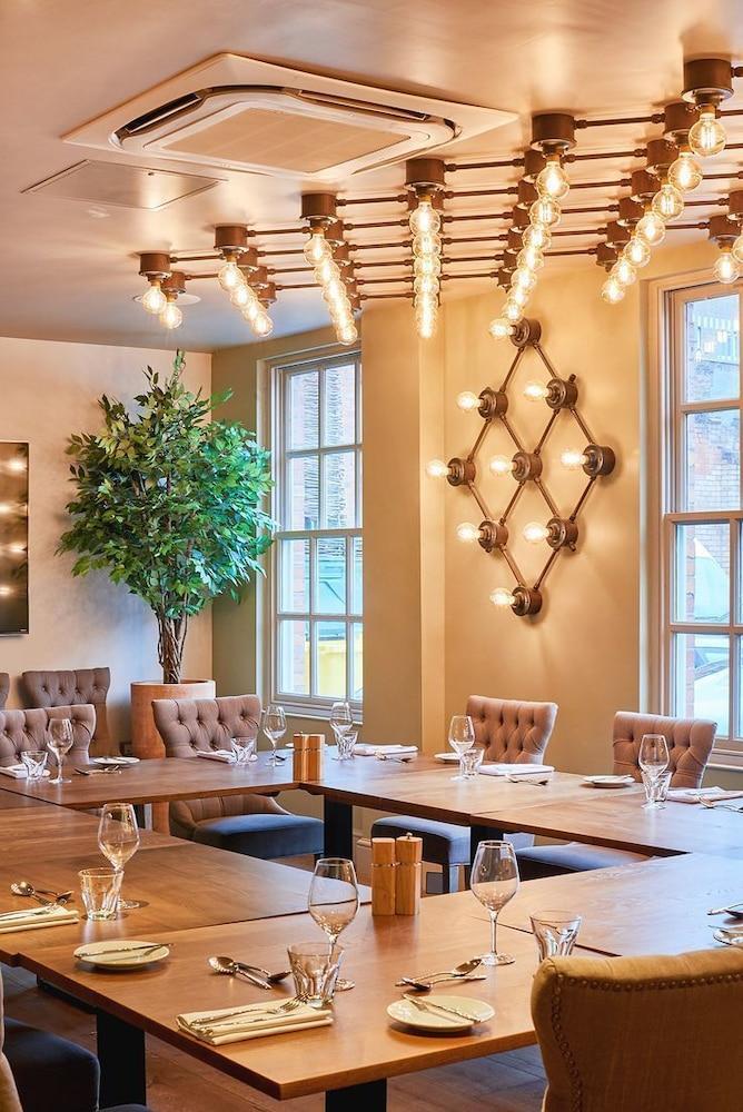 Private dining room with tufted chairs, perfect for meetings and intimate events.