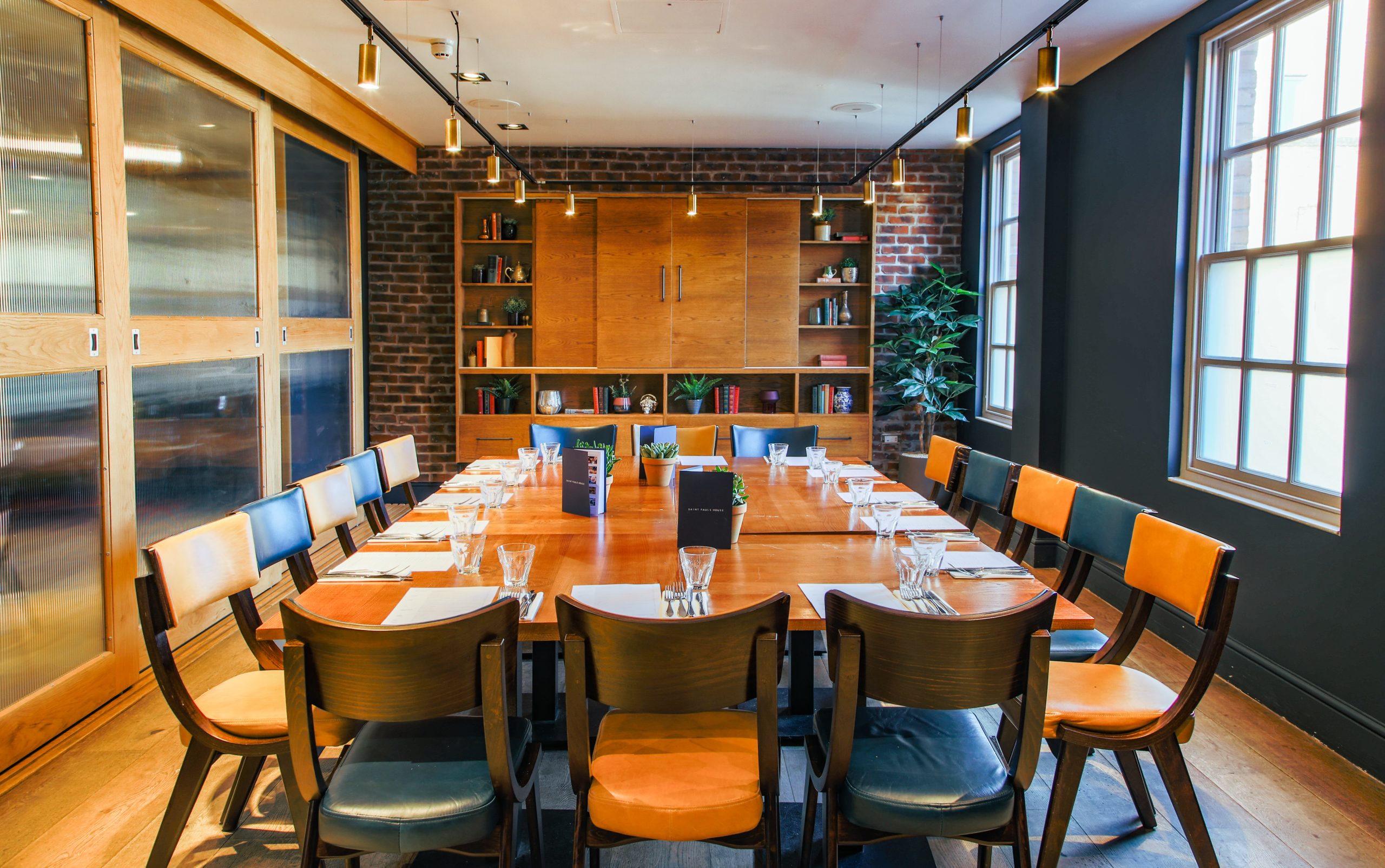 Intimate meeting room with wooden table, ideal for corporate events in Saint Pauls House.