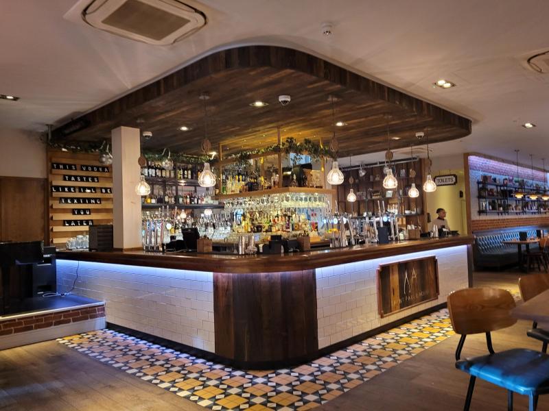 Stylish bar area in Saint Pauls House, ideal for networking events and casual gatherings.