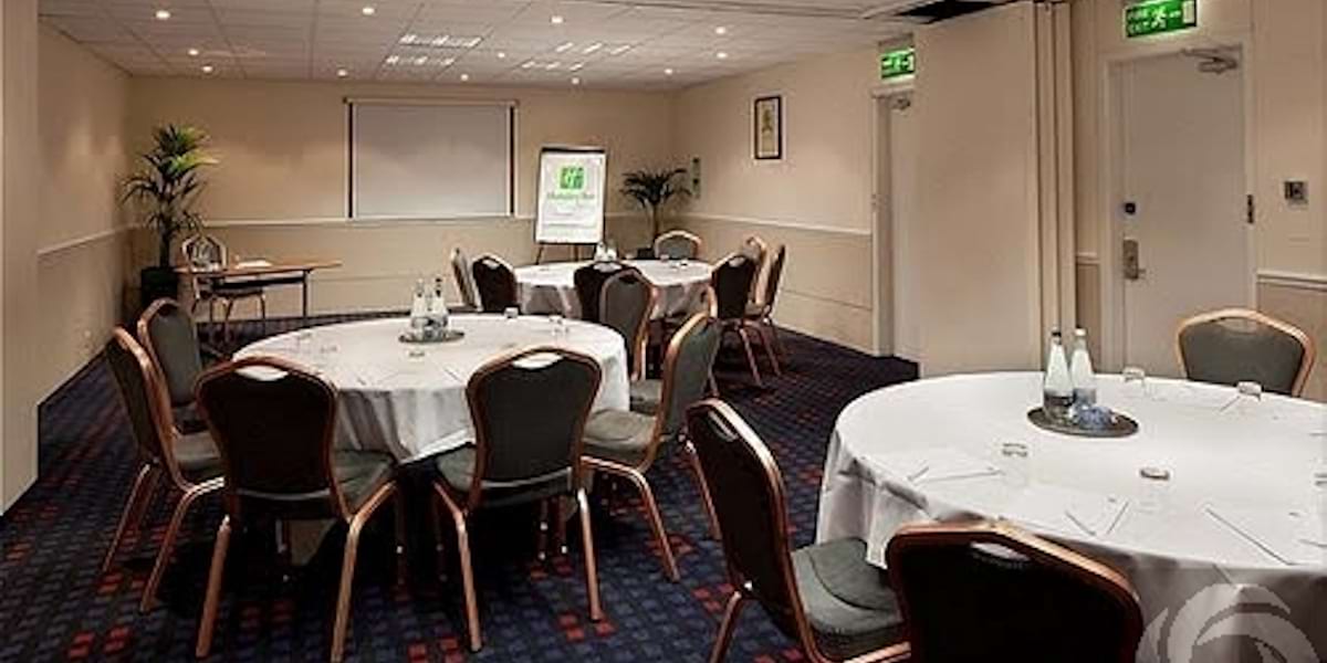 Conference Suite with round tables, ideal for meetings and workshops.