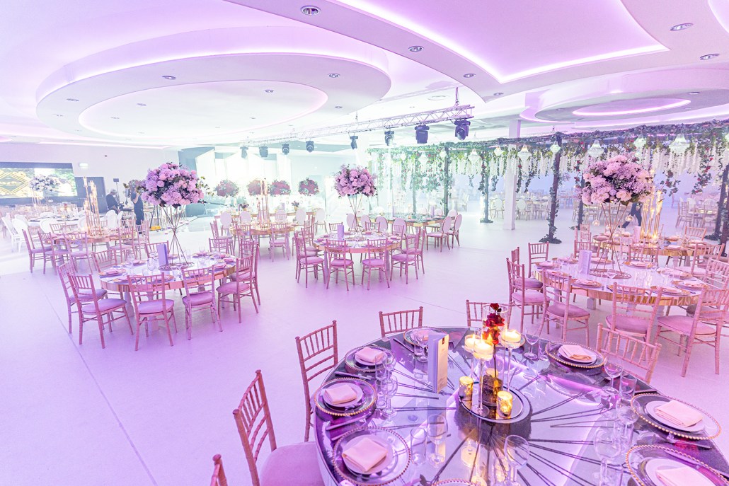 Elegant Banqueting Suite with round tables, ideal for weddings and corporate events.