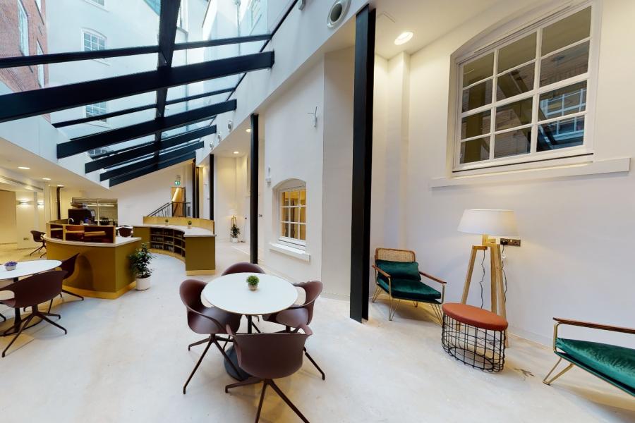 Modern conference space with natural light, ideal for meetings and workshops.