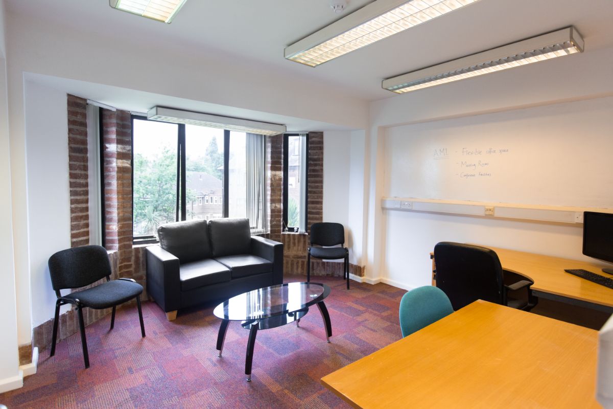 Versatile meeting space with natural light for productive brainstorming sessions.