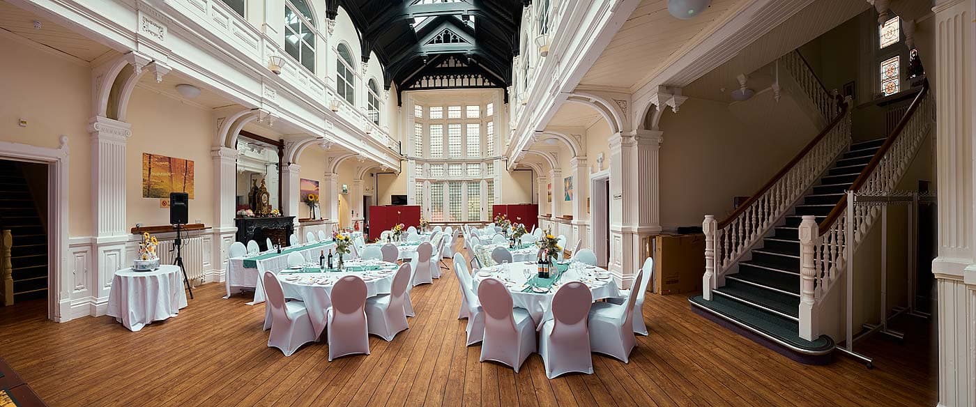 Spacious Uffculme Centre venue with elegant tables for weddings and corporate events.