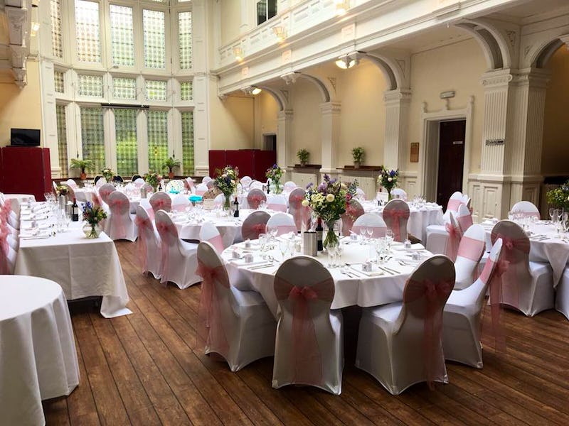 Elegant conference center with floral decor, ideal for weddings and formal events.