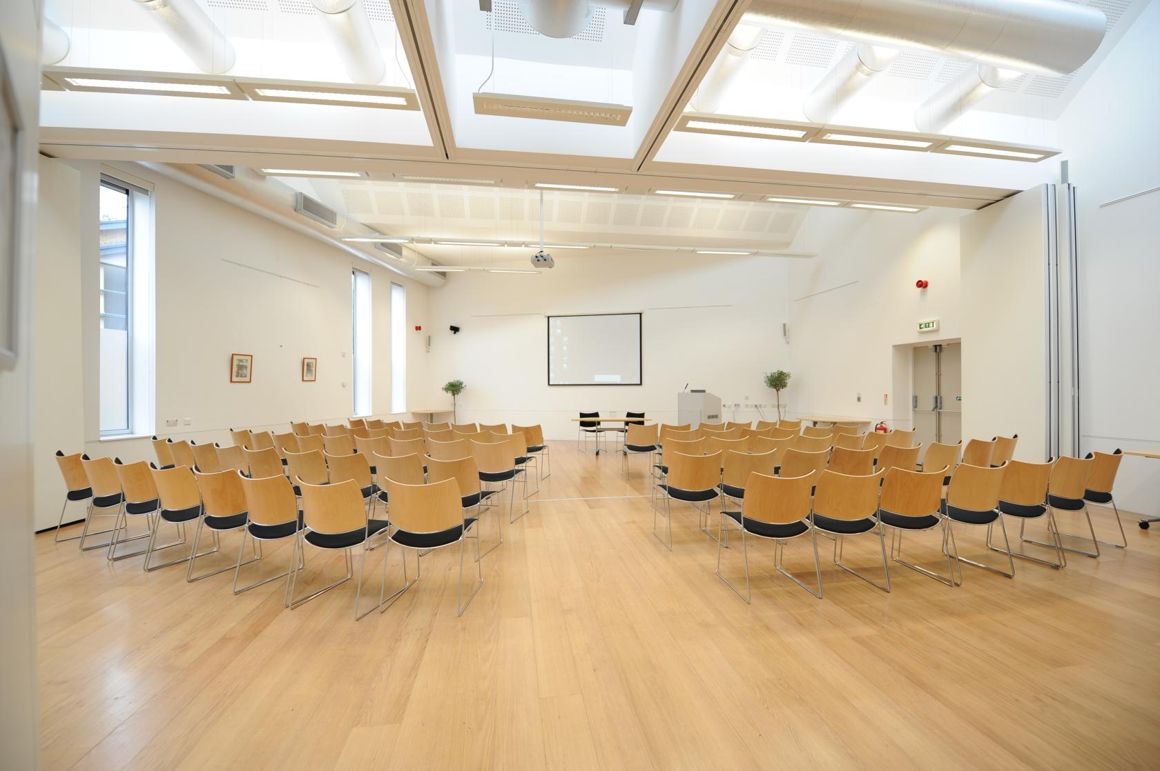 Versatile seminar space with theater seating, ideal for workshops and corporate meetings.