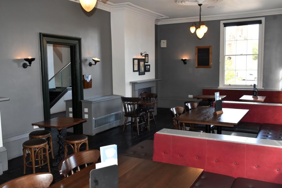 Versatile event space with cozy ambiance, ideal for networking and meetings.