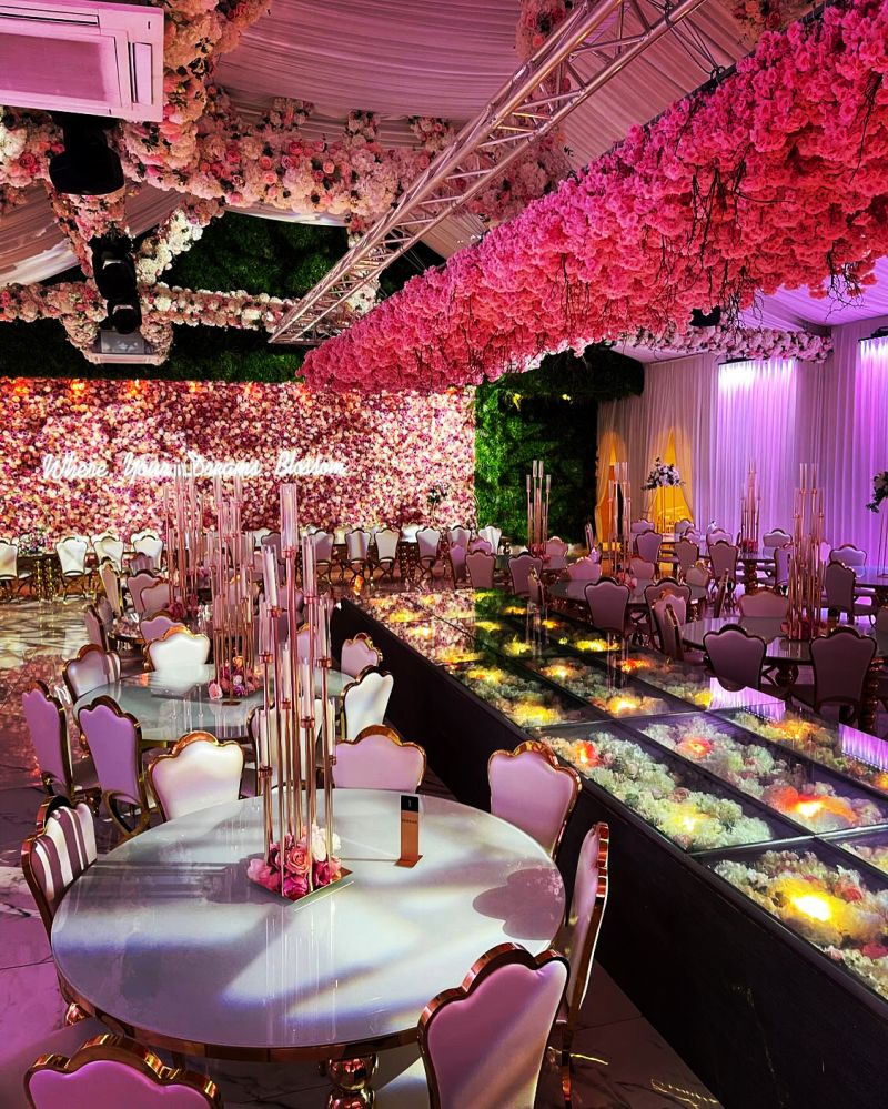 Elegant Grand Botanical Suite event space with floral backdrop for upscale gatherings.