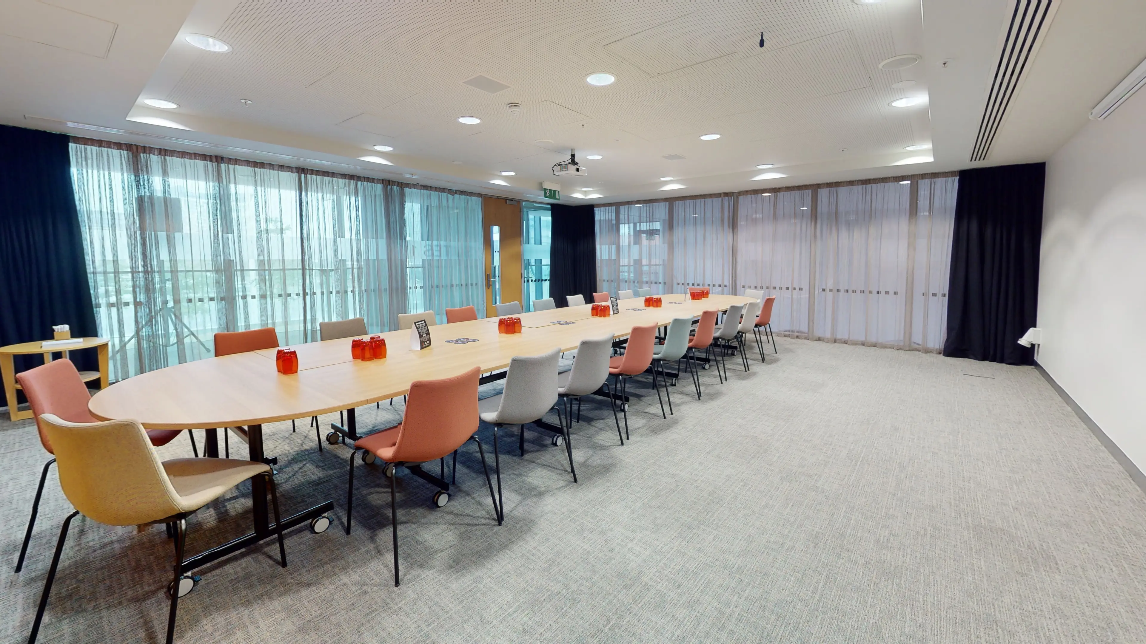 Modern boardroom with oval table, ideal for workshops in Jewellery Quarter Conference Centre.