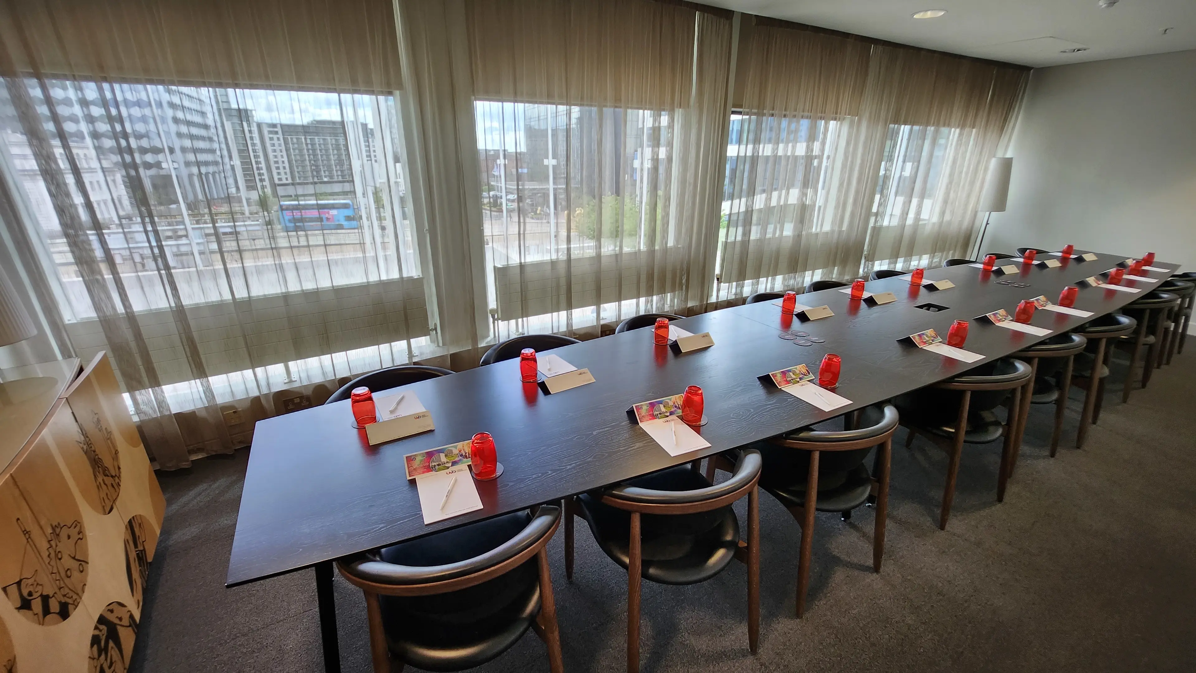 Boardroom in Jewellery Quarter Conference Centre with red accents for professional meetings.