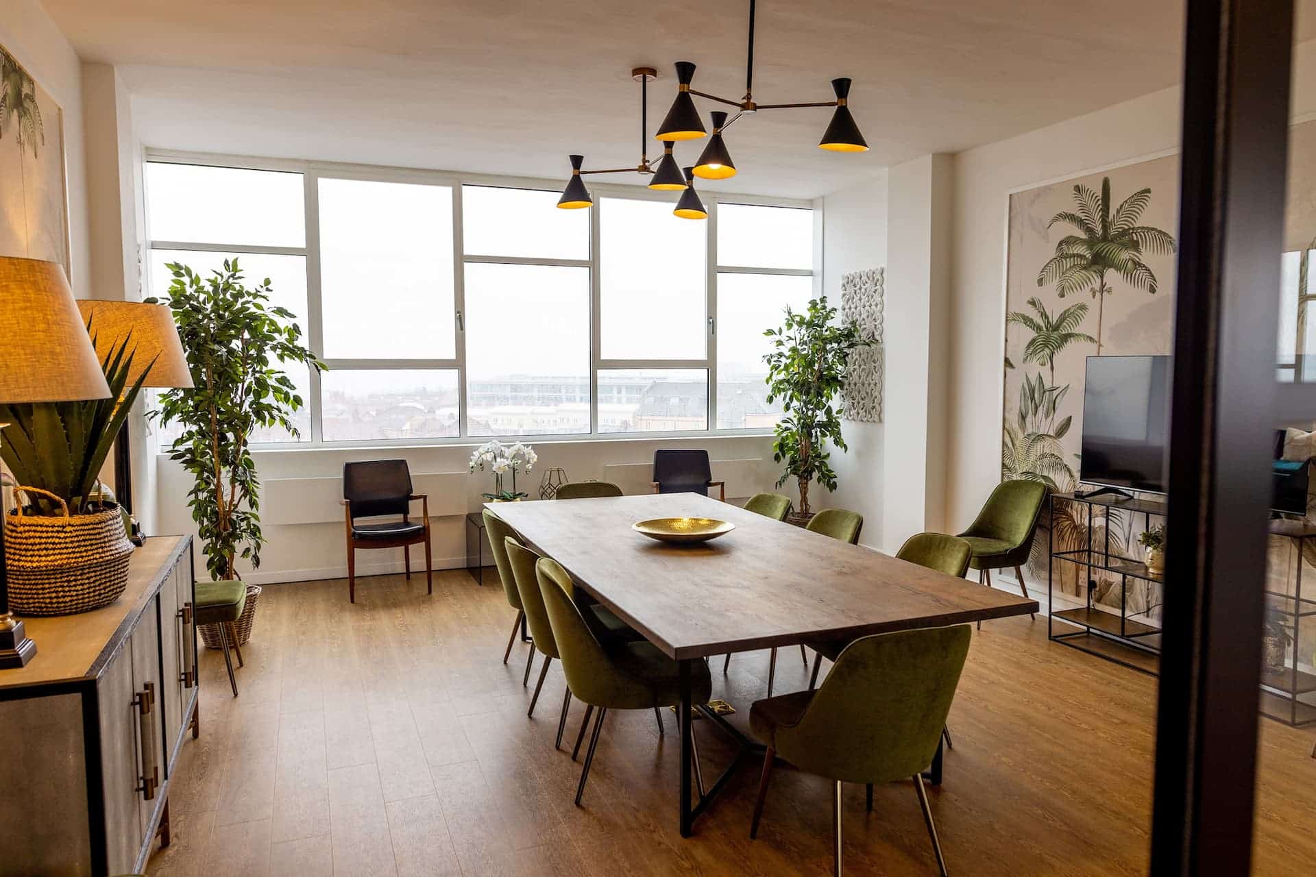Modern meeting space in Birmingham's Jewellery Quarter with natural light and stylish furniture.