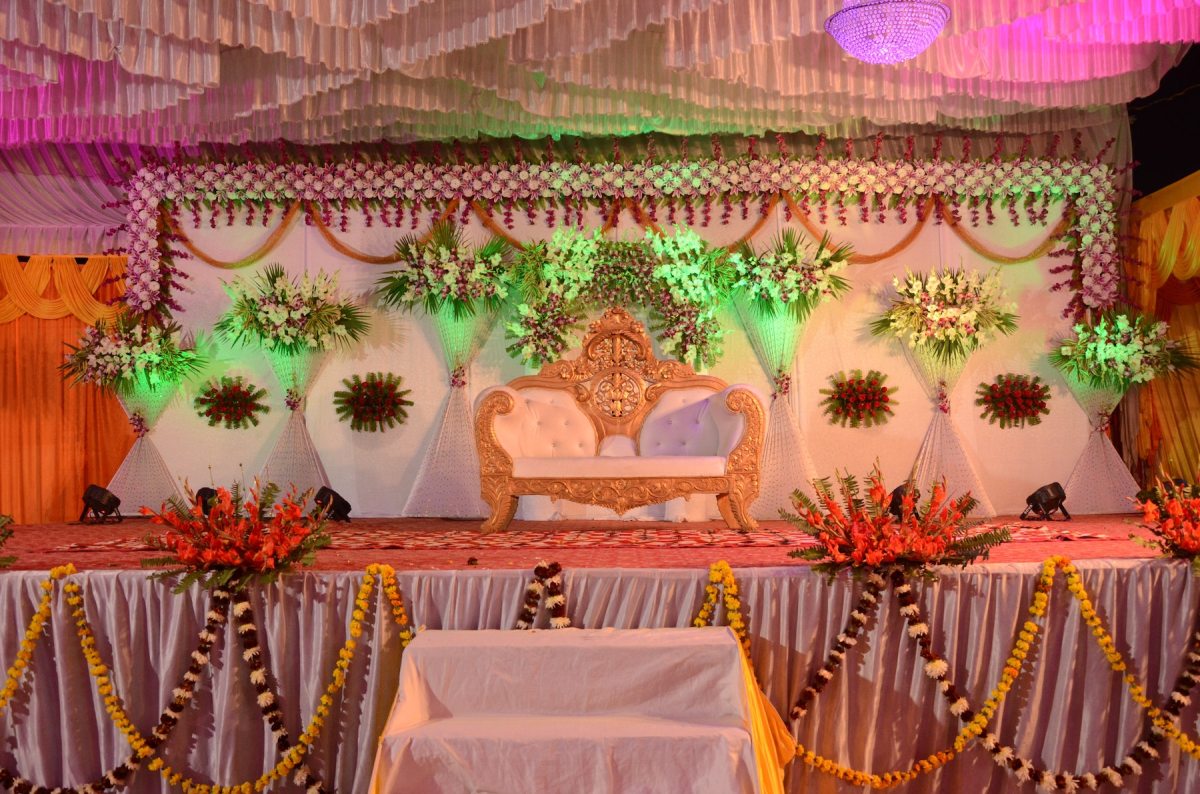 Shamas Hall stage with ornate seating, ideal for weddings and cultural events.
