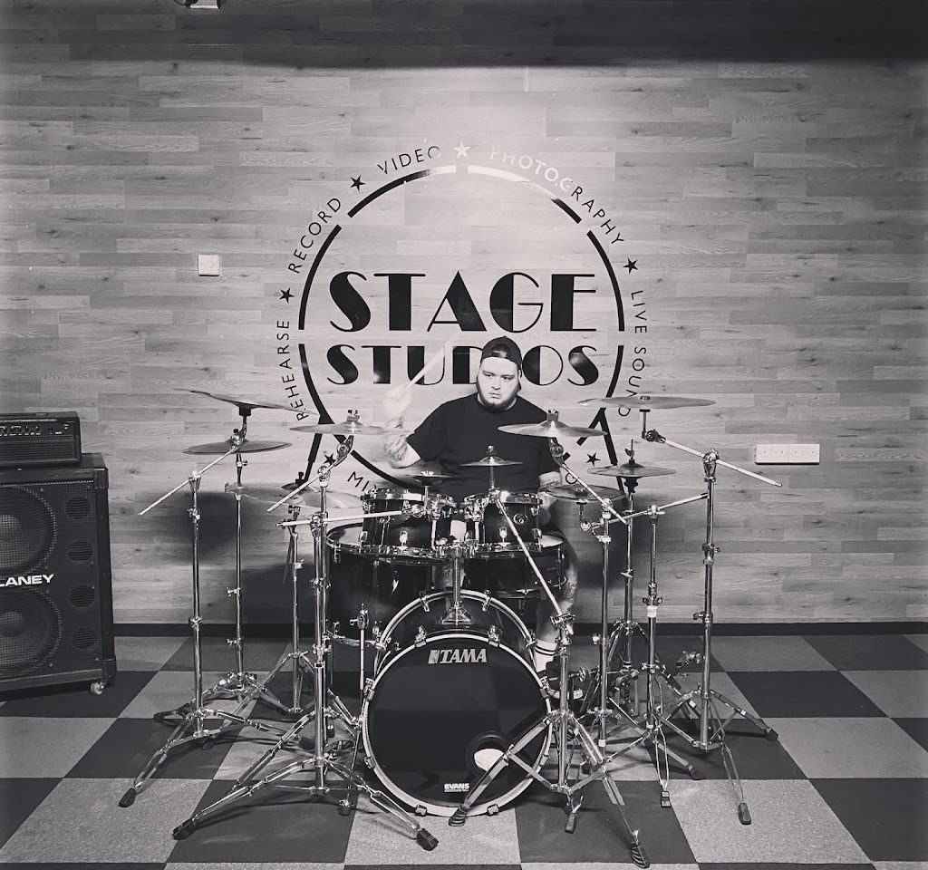 Drummer performing in Stage Studios, ideal for live music events and rehearsals.