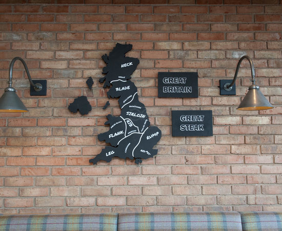 Restaurant wall display with Great Britain map, ideal for themed dining events.