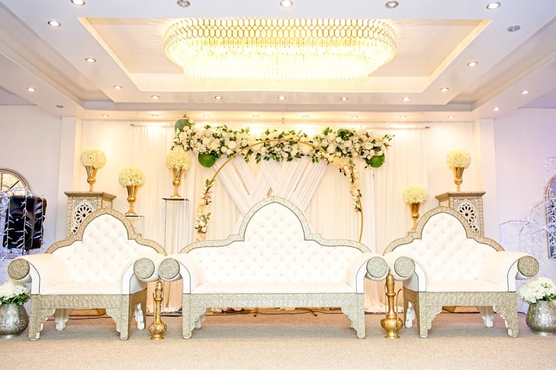 Elegant Banqueting Suite with ornate couches, perfect for weddings and formal events.