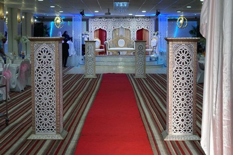 Elegant Banqueting Suite with red carpet, perfect for weddings and formal events.