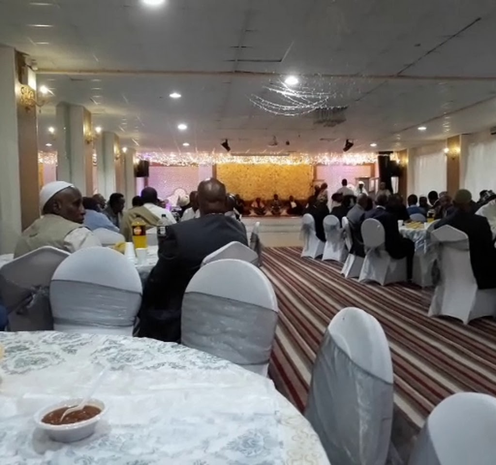 Elegant Banqueting Suite with white chair covers, perfect for networking events and celebrations.