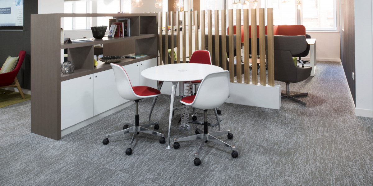Modern meeting room at Edmund House, Birmingham with round table and ergonomic chairs.