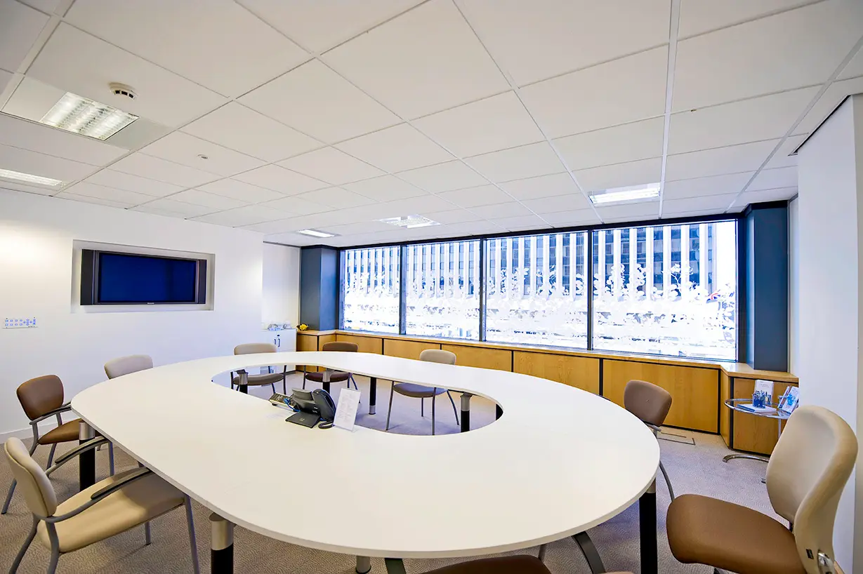 Modern meeting room with oval table in Regus Birmingham City Centre for workshops and meetings.