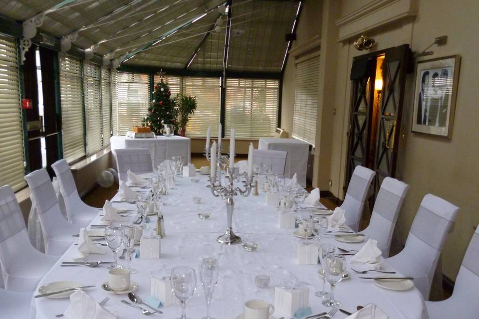 Elegant dining table with candelabra at Westley Hotel for corporate events or celebrations.