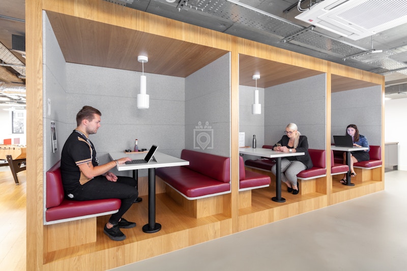 Modern cafe booths in Lewis Building for focused meetings and collaborative sessions.