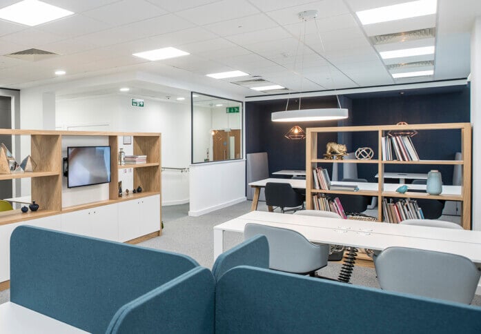 Modern meeting room in Apex House with natural light, ideal for brainstorming sessions.