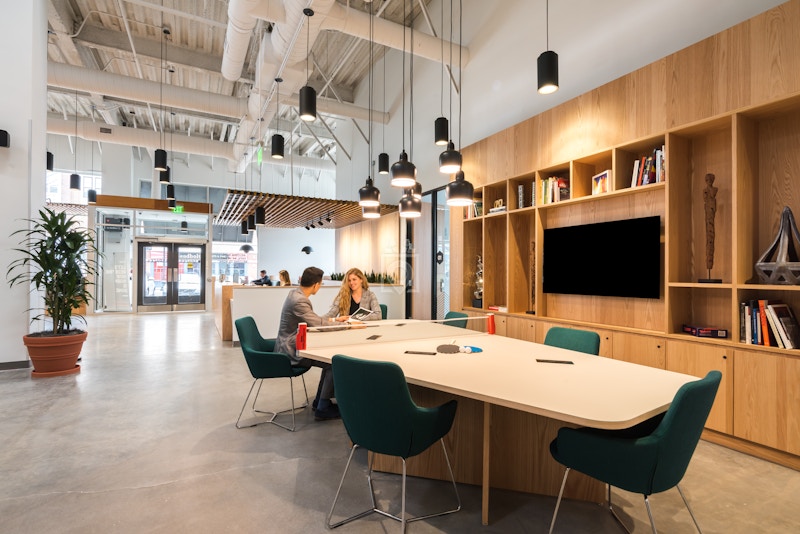 Modern meeting space at Virtual Office Plus with large table, ideal for team collaboration.