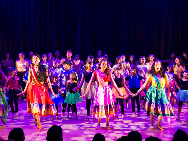 Vibrant dance performance in colorful costumes at Aaja Nachle Let's Dance event.