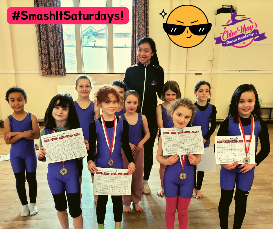 Young dancers celebrate achievements with certificates at Chloe May's Dance Academy.