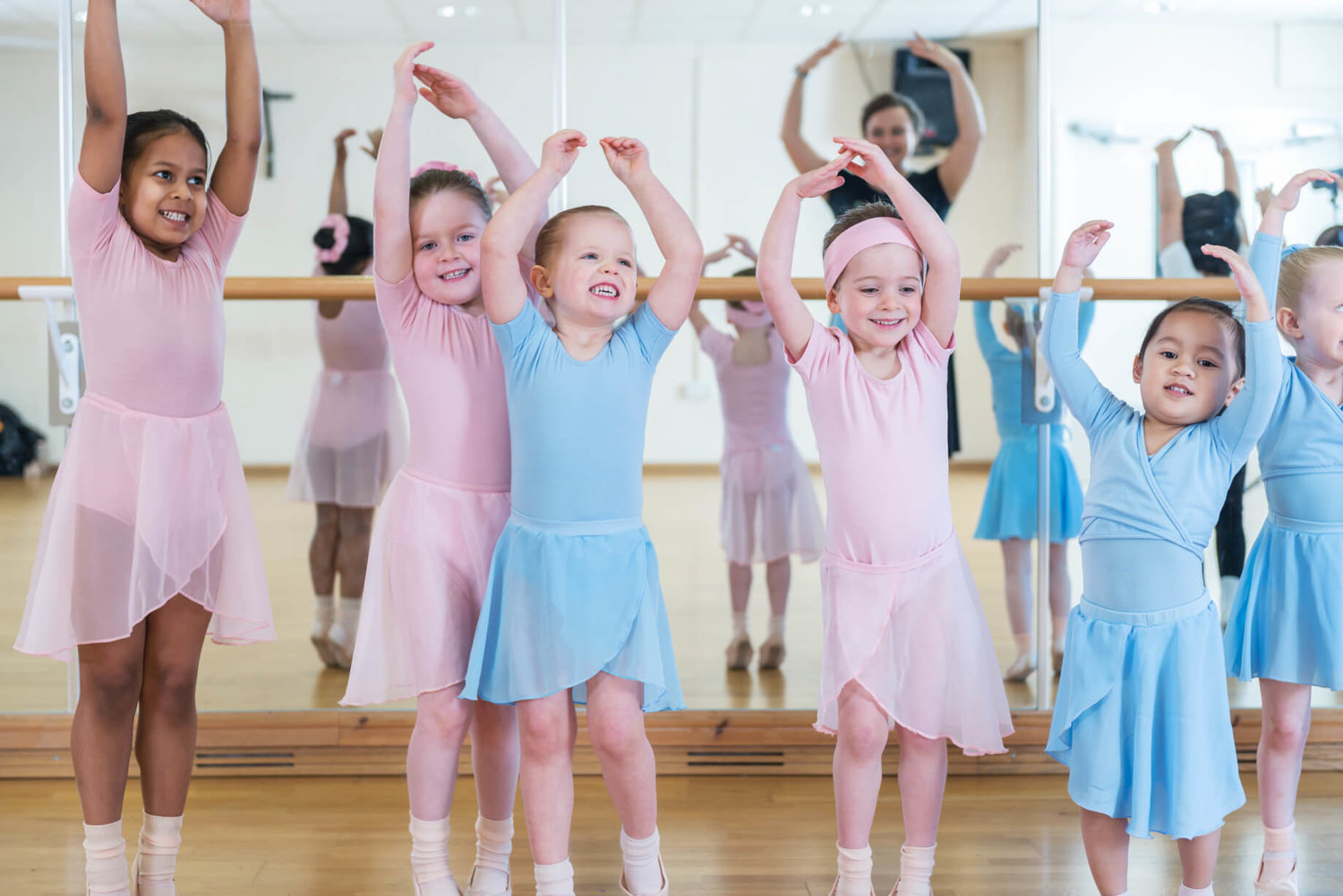 Young dancers in colorful ballet attire at Rutleigh Norris School of Dance class.