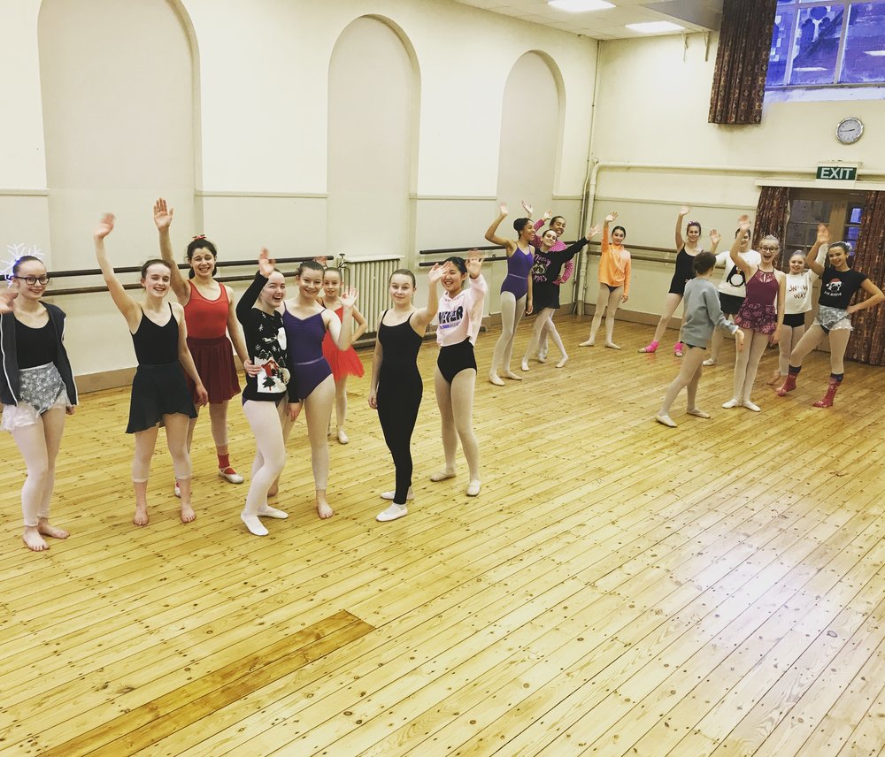 Vibrant dance rehearsal in spacious Rutleigh Norris School studio, ideal for workshops and performances.