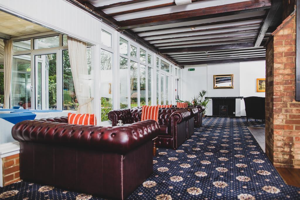 Stylish lounge at The Yenton Hotel, featuring plush sofas for networking events.