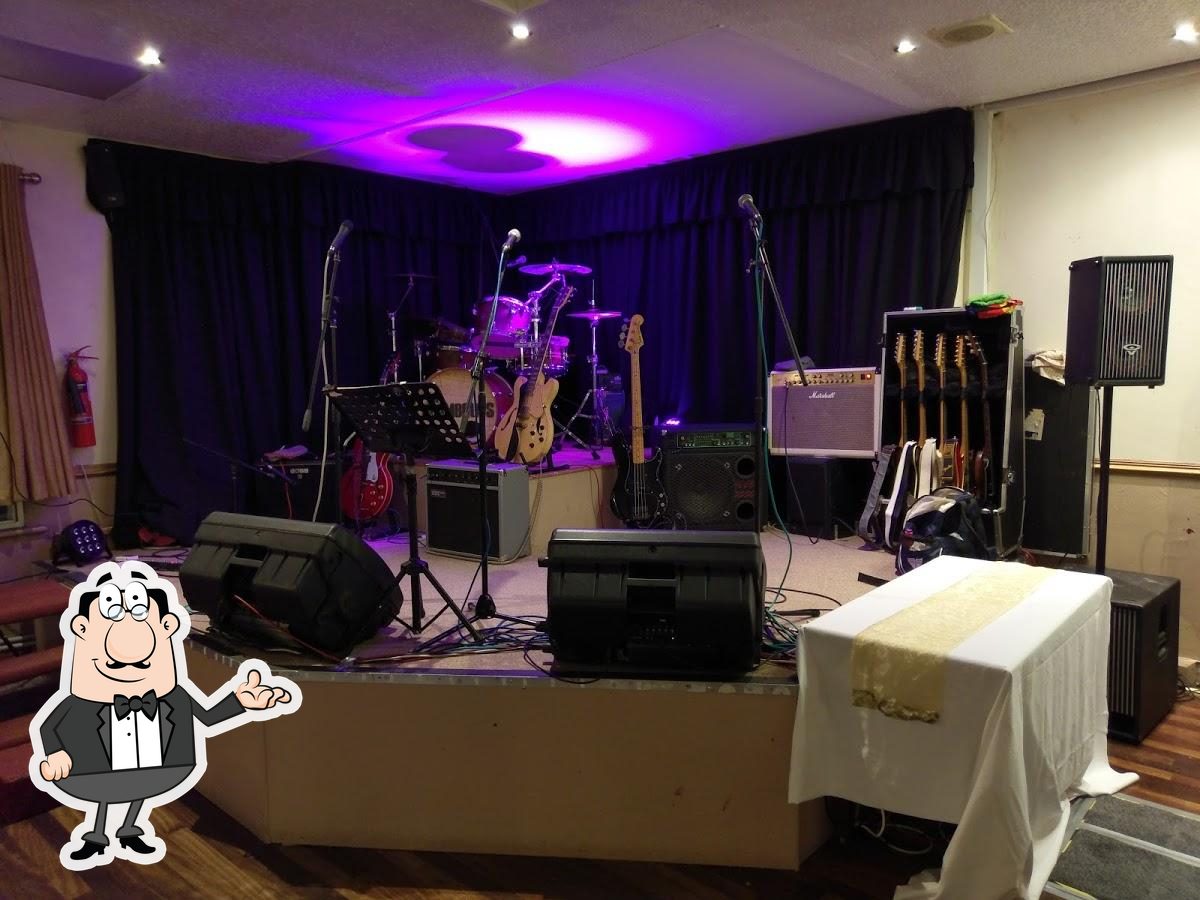 Cobham Lounge stage setup with purple lighting for live performances and events.