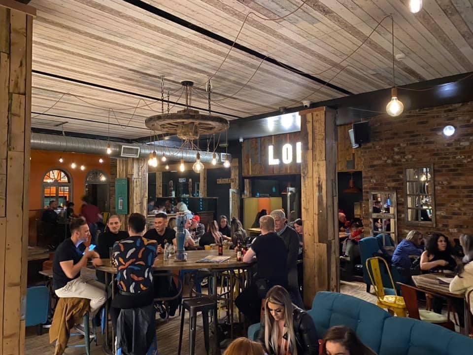 Vibrant networking venue with warm lighting, ideal for social gatherings and corporate events.