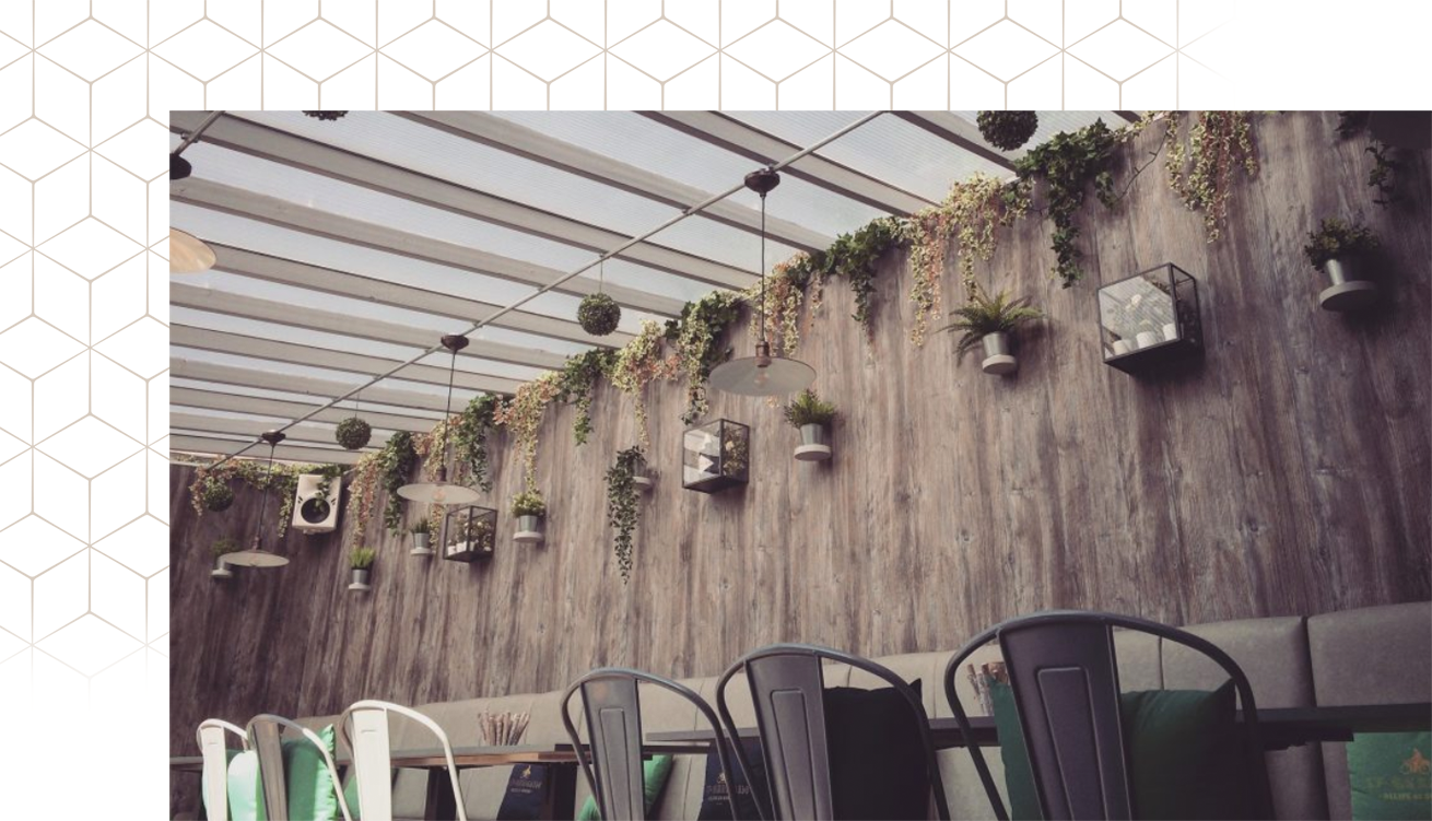 Stylish function room with glass ceiling, perfect for meetings and social gatherings.