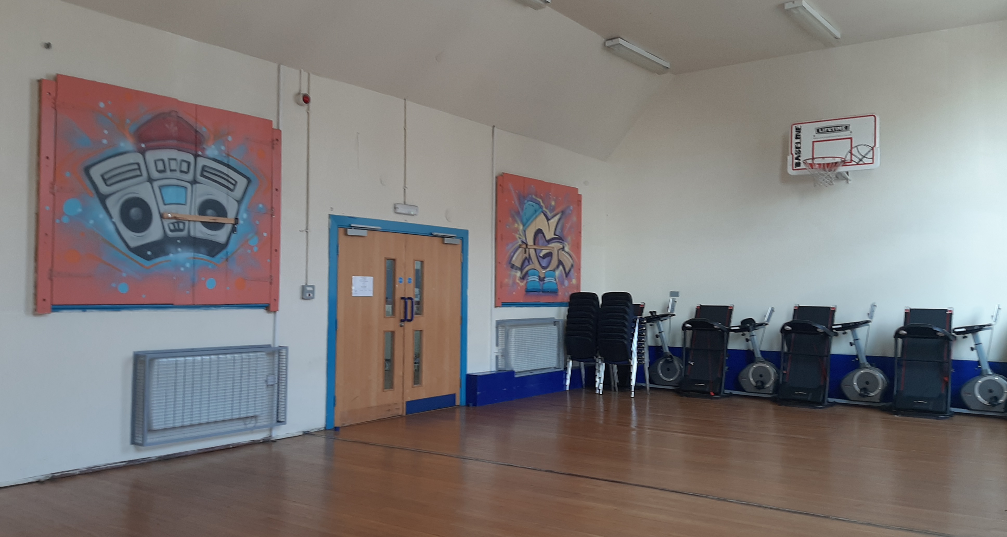 Tina Philips Training Room with vibrant graffiti, ideal for events and workshops.