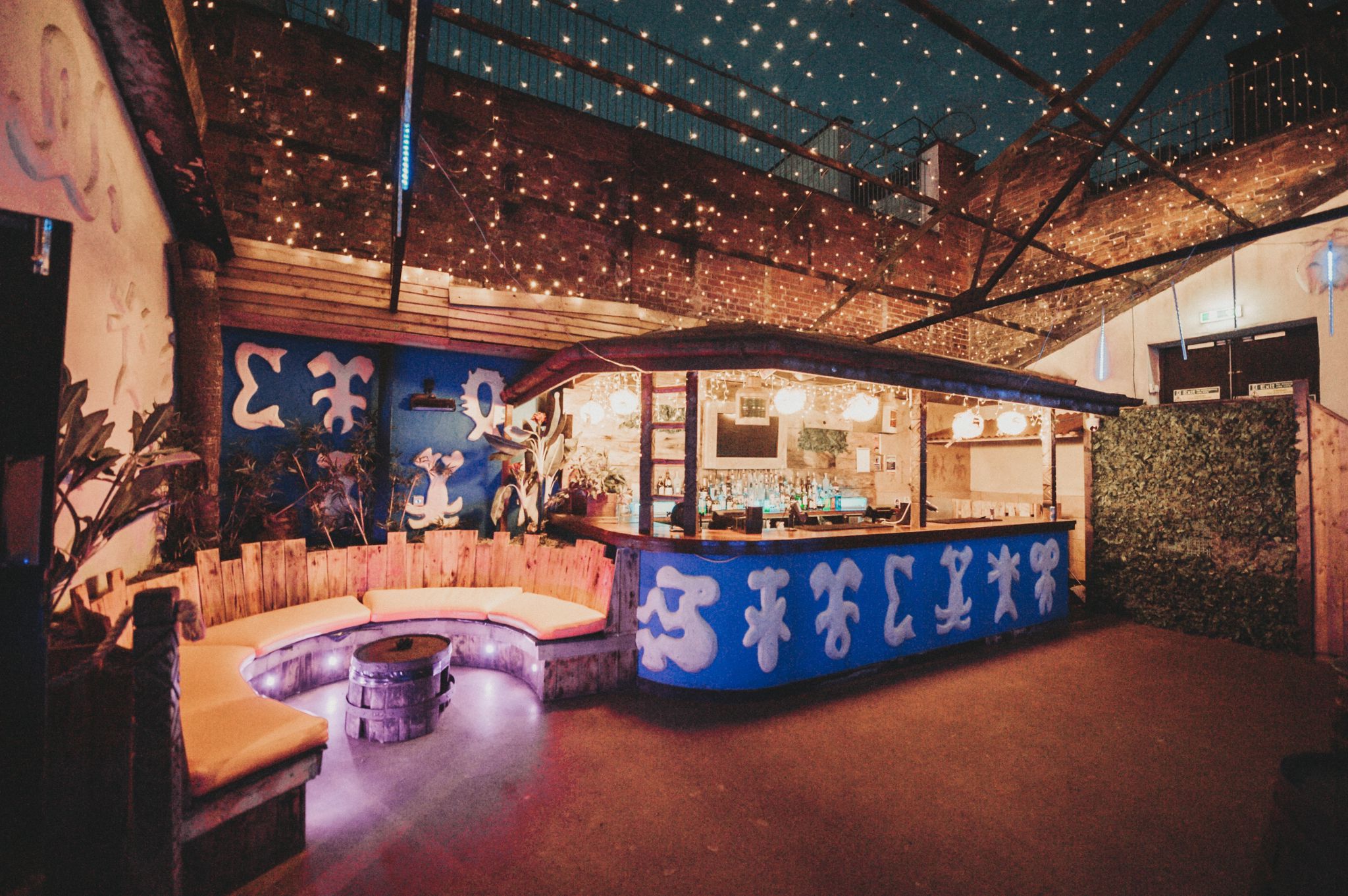 Tiki Garden Terrace bar with cozy seating, perfect for networking events and gatherings.