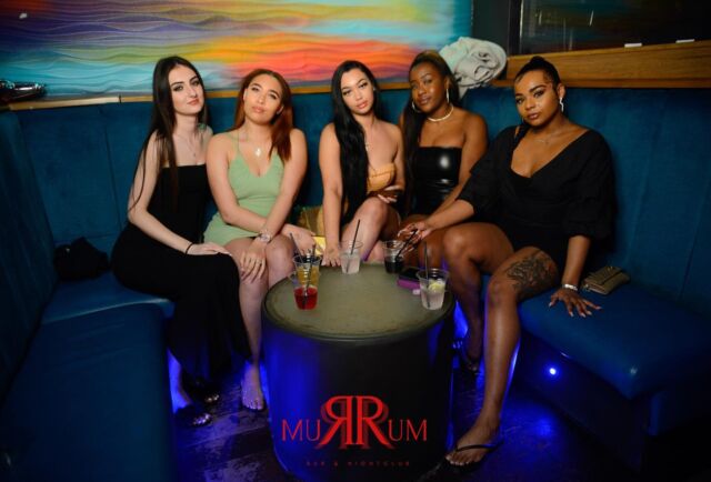 Vibrant Rum Rum Bar nightclub with cocktails, perfect for networking events and parties.