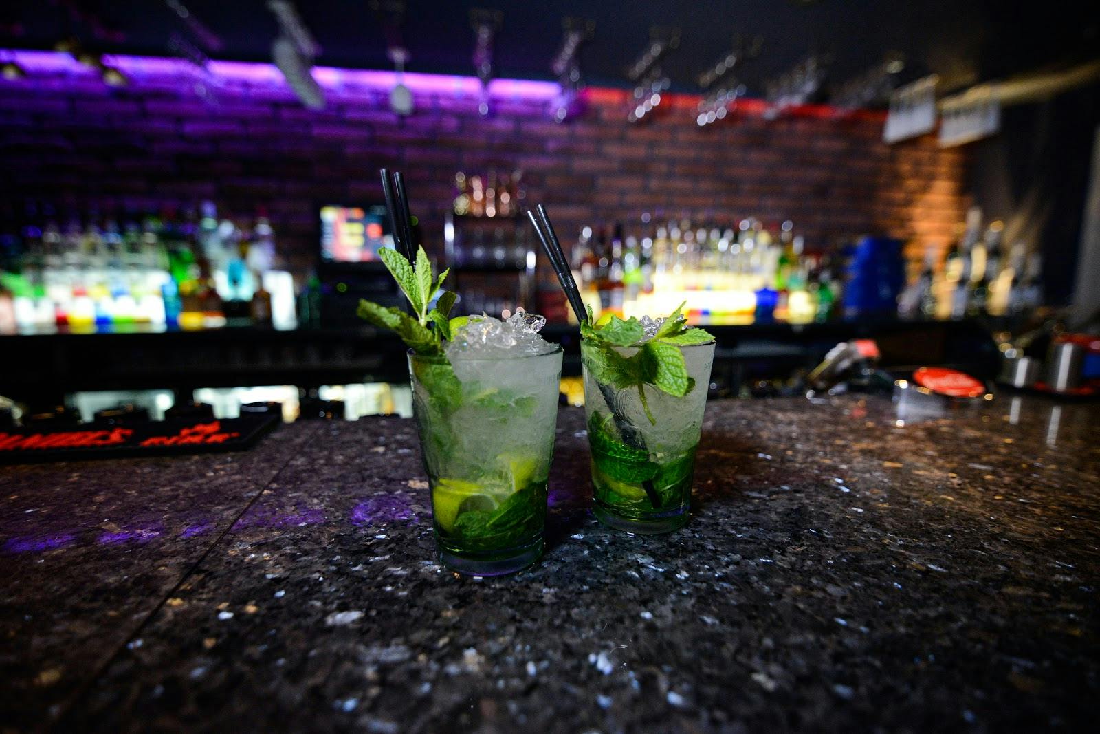 Vibrant Rum Rum Bar with refreshing mojitos, ideal for networking events and social gatherings.