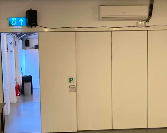 Minimalist event space in Rhythmic Health, ideal for meetings and gatherings.