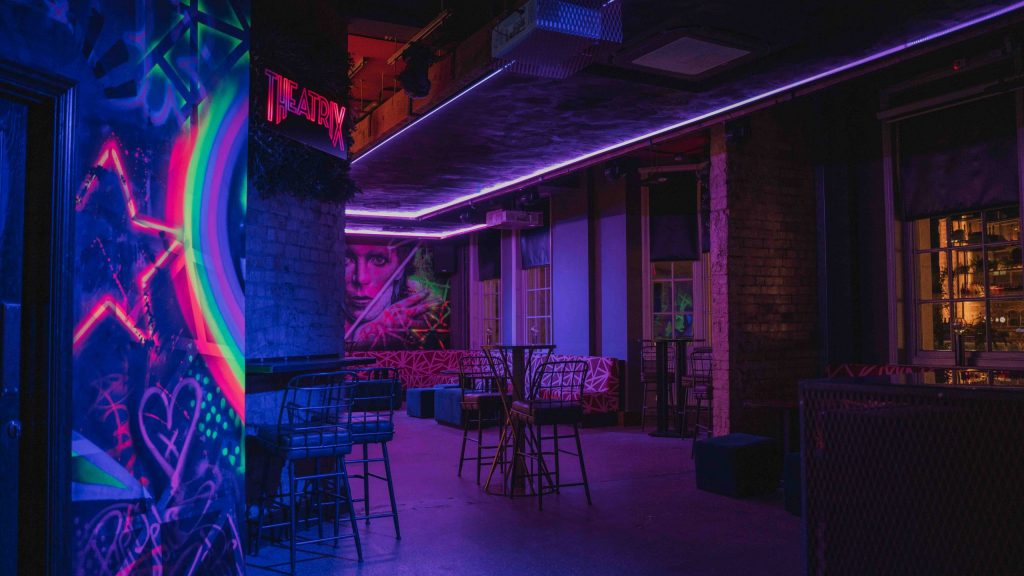 Vibrant event space with neon lighting in Theatrix Birmingham for creative gatherings.