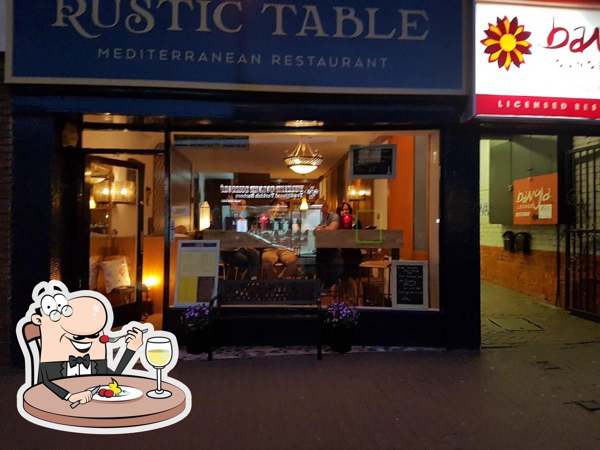 Charming Mediterranean restaurant with warm lighting, perfect for intimate gatherings and events.