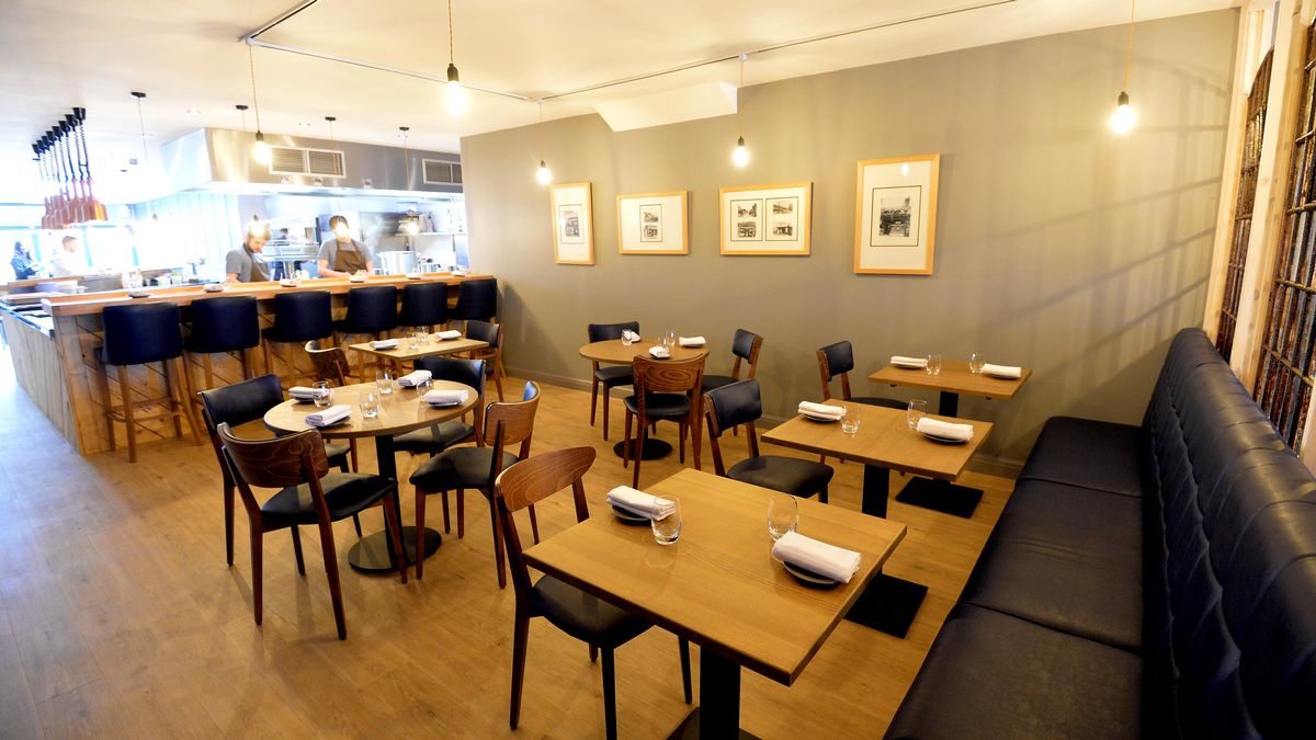 Modern bar in Harborne Kitchen, warm lighting, ideal for intimate events and networking.