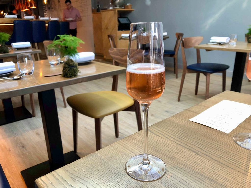 Stylish Harborne Kitchen bar with sparkling rosé, ideal for corporate events and gatherings.