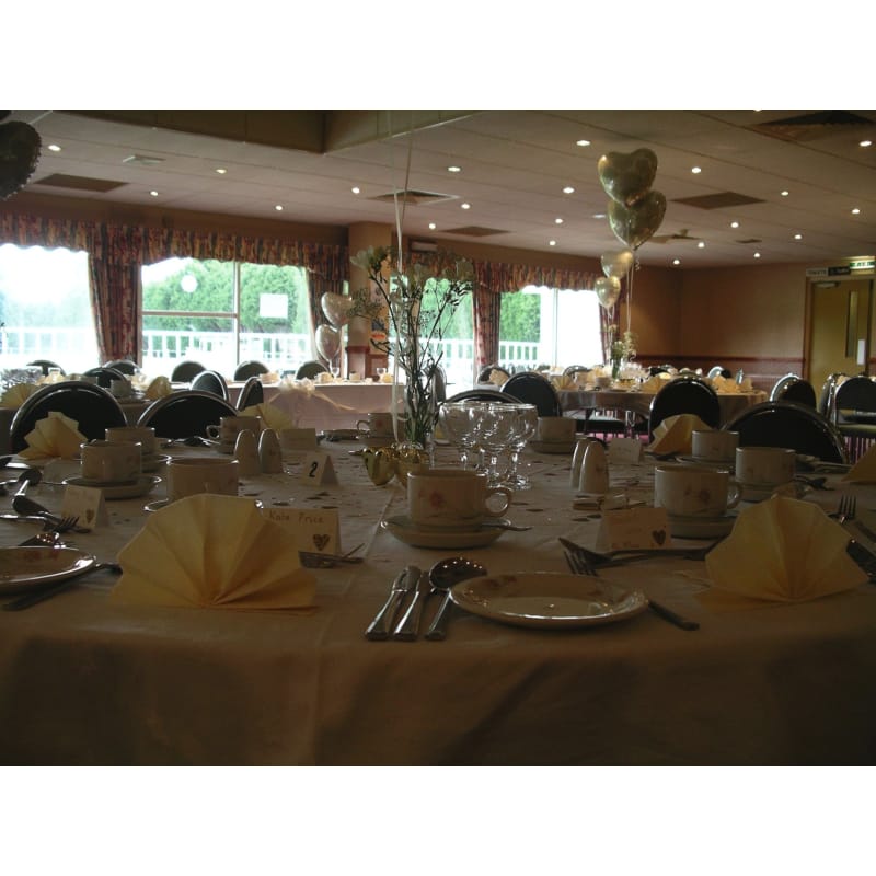 Elegant Blythe Room banquet setup for weddings and corporate events with cream linens.