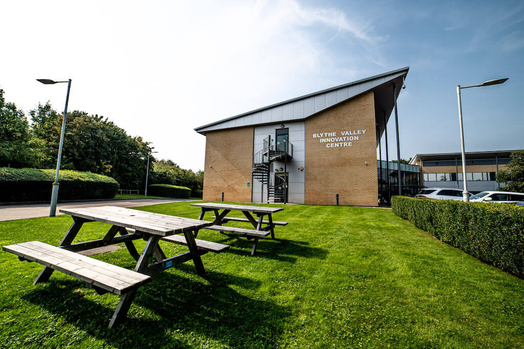 Modern Blythe Room venue with outdoor seating, perfect for meetings and events.