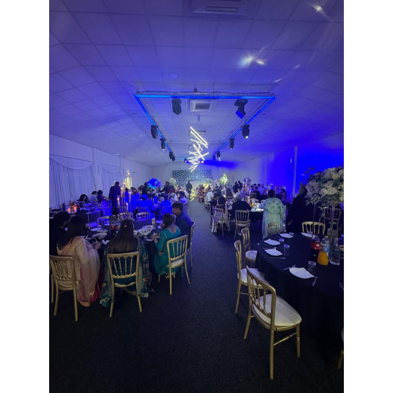 Elegant event hall with floral centerpieces, perfect for weddings and corporate events.