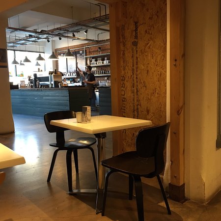 Cozy OIKOS Café room hire for informal meetings and networking events.